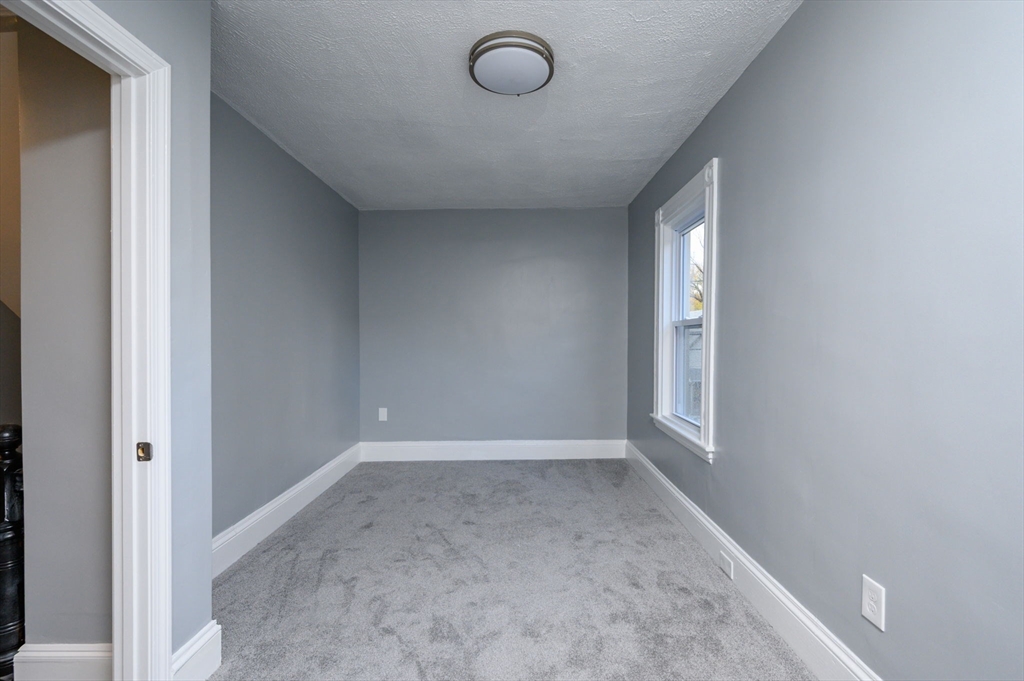 485 Temple Street Whitman, MA 02382 - Photo 20 of 34 a view of an empty room and window