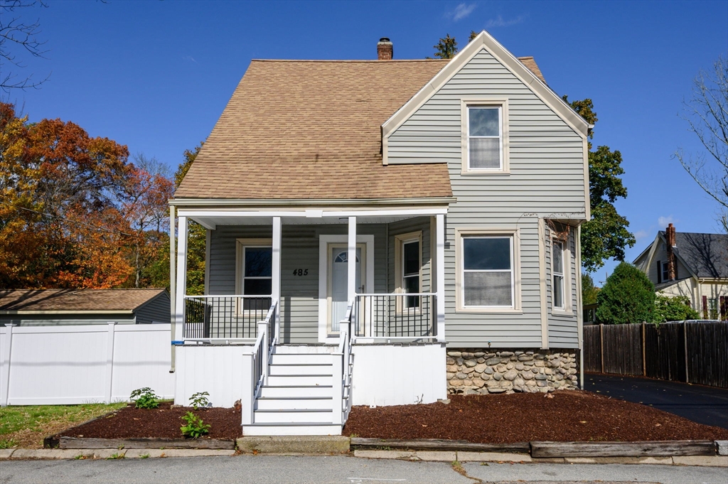 485 Temple Street Whitman, MA 02382 - Photo 2 of 34 a front view of a house with a yard