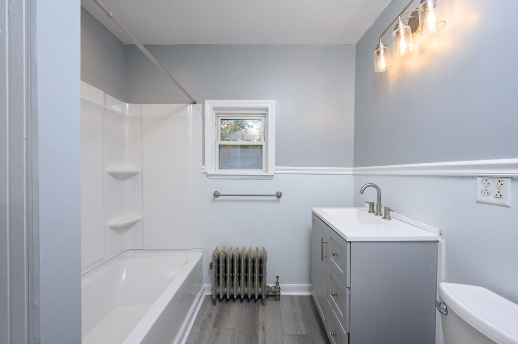 485 Temple Street Whitman, MA 02382 - Photo 26 of 34 a bathroom with a sink a toilet and bathtub