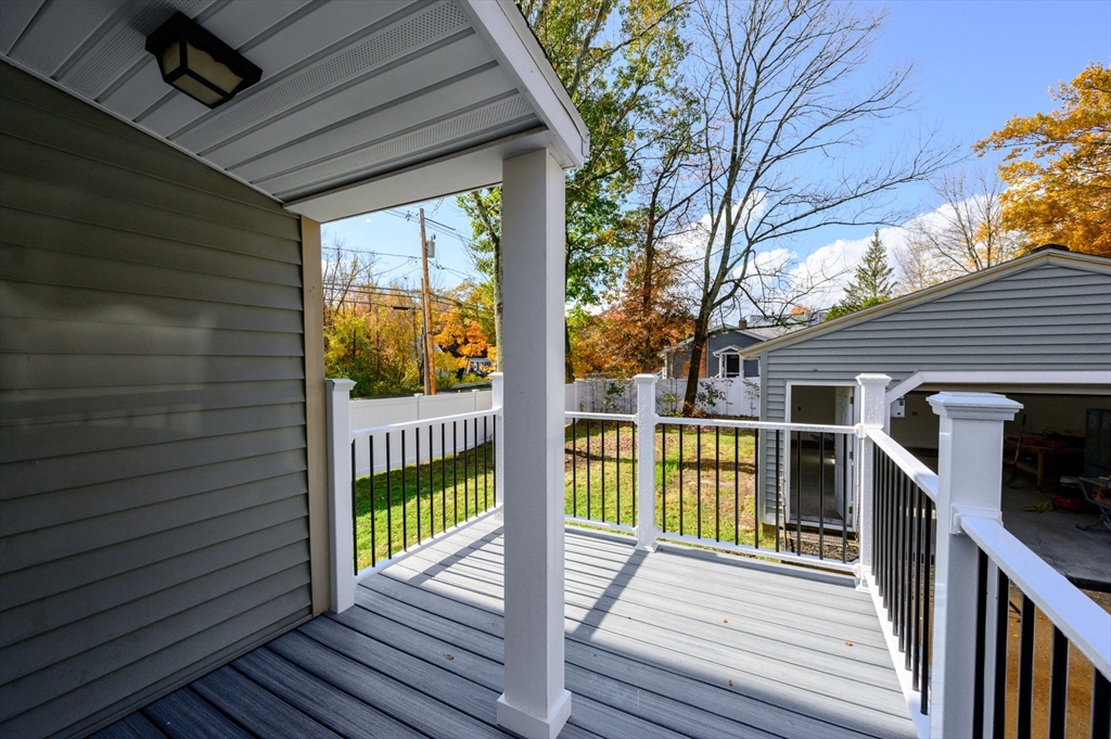 485 Temple Street Whitman, MA 02382 - Photo 4 of 34 a view of a balcony with wooden floor