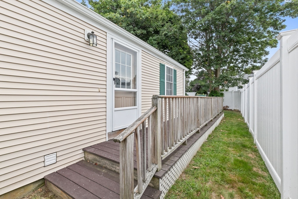 9 Foam Road Scituate, MA 02066 - Photo 14 of 19 a view of a backyard with wooden fence