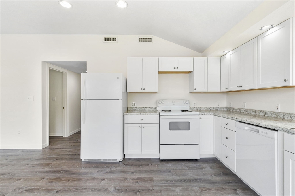 9 Foam Road Scituate, MA 02066 - Photo 5 of 19 a kitchen with white cabinets and white appliances