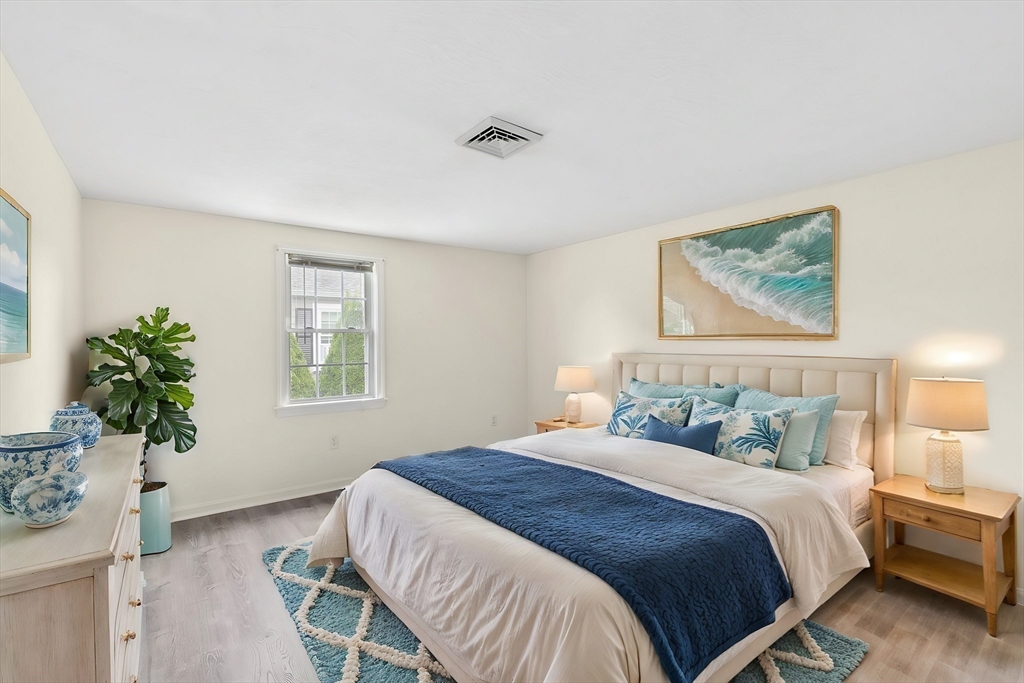 9 Foam Road Scituate, MA 02066 - Photo 7 of 19 a bedroom with a bed and a potted plant