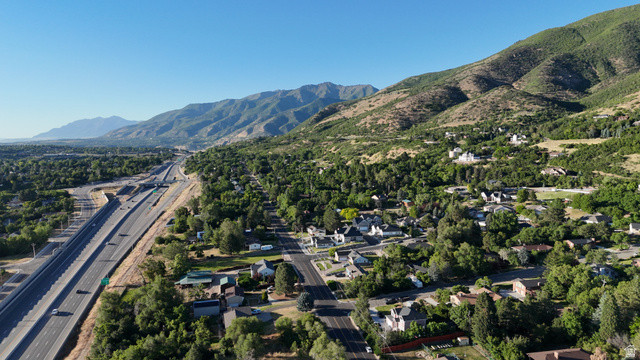 1792 Valley View Drive Layton, UT 84040 - Photo 12 of 18 Mountainous terrain and lush green landscape frame the surrounding residential area