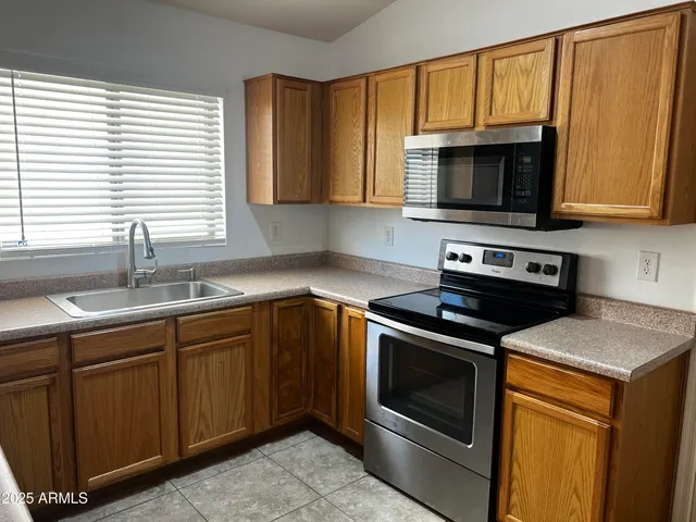 a view of washer and dryer with wooden floor
