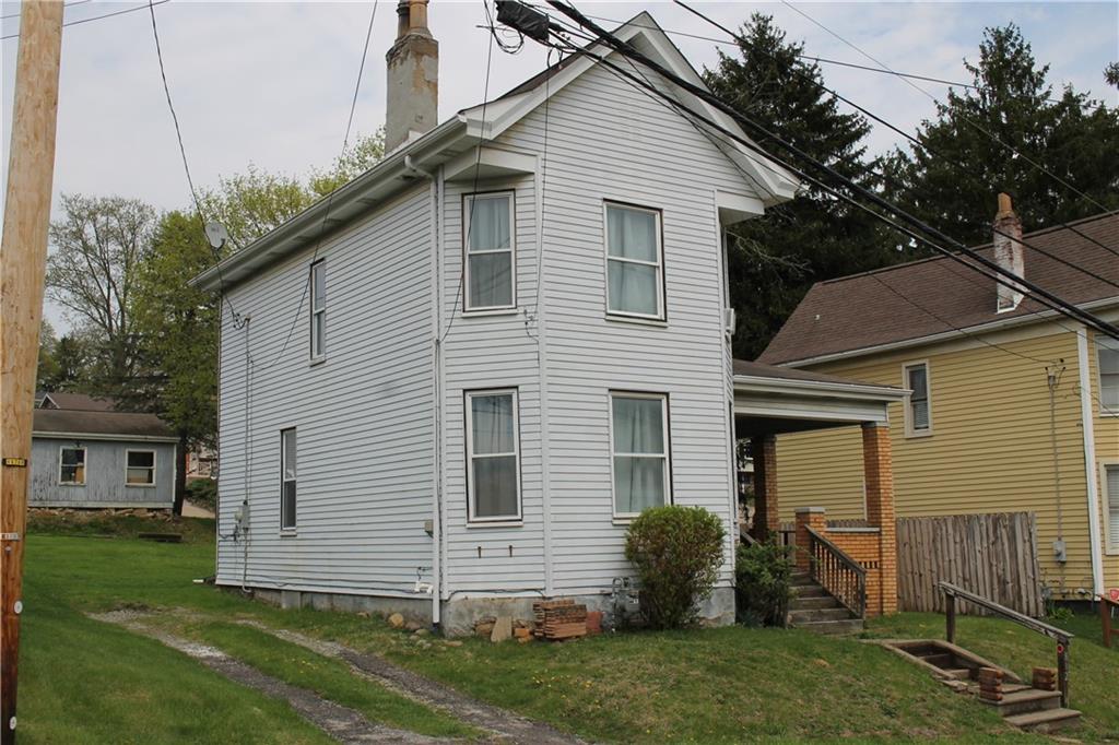 812 5th Street Rochester, PA 15074 - Photo 13 of 13 a view of a white house next to a yard
