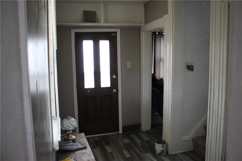 812 5th Street Rochester, PA 15074 - Photo 2 of 13 a view of a hallway with wooden door