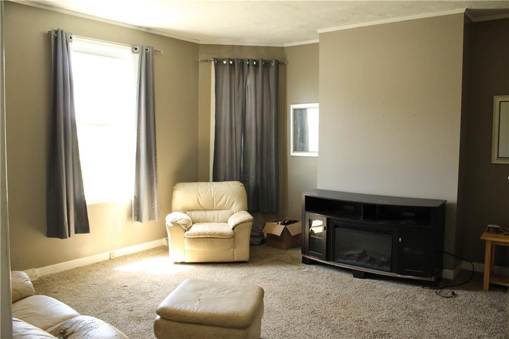 812 5th Street Rochester, PA 15074 - Photo 3 of 13 a living room with furniture and a window