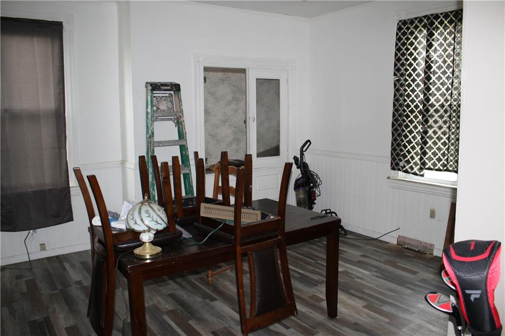 812 5th Street Rochester, PA 15074 - Photo 4 of 13 a view of a dining room with furniture and wooden floor
