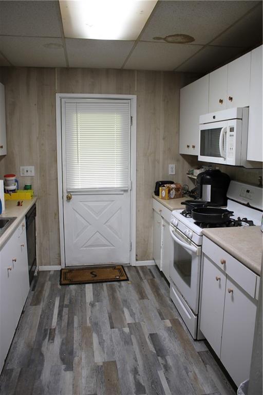 812 5th Street Rochester, PA 15074 - Photo 5 of 13 a kitchen with granite countertop a stove a sink and a refrigerator