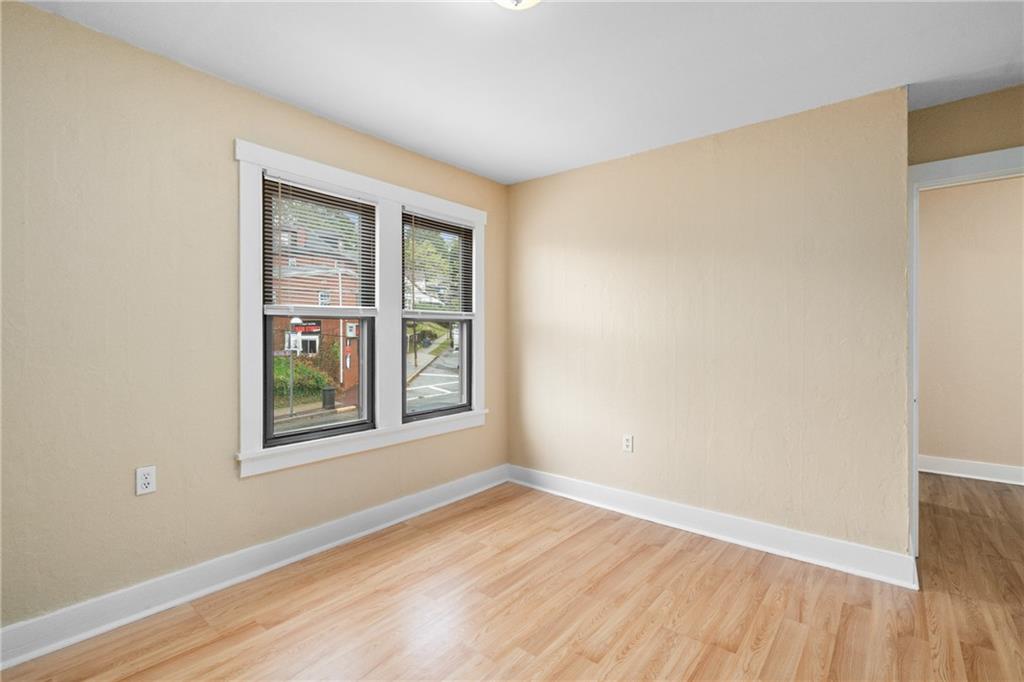 3612 Main Street Homestead, PA 15120 - Photo 20 of 30 an empty room with wooden floor and windows