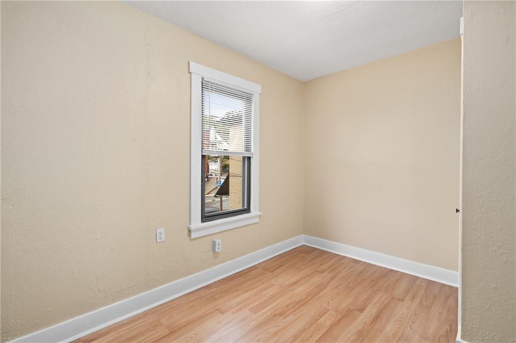 3612 Main Street Homestead, PA 15120 - Photo 21 of 30 an empty room with a window and wooden floor