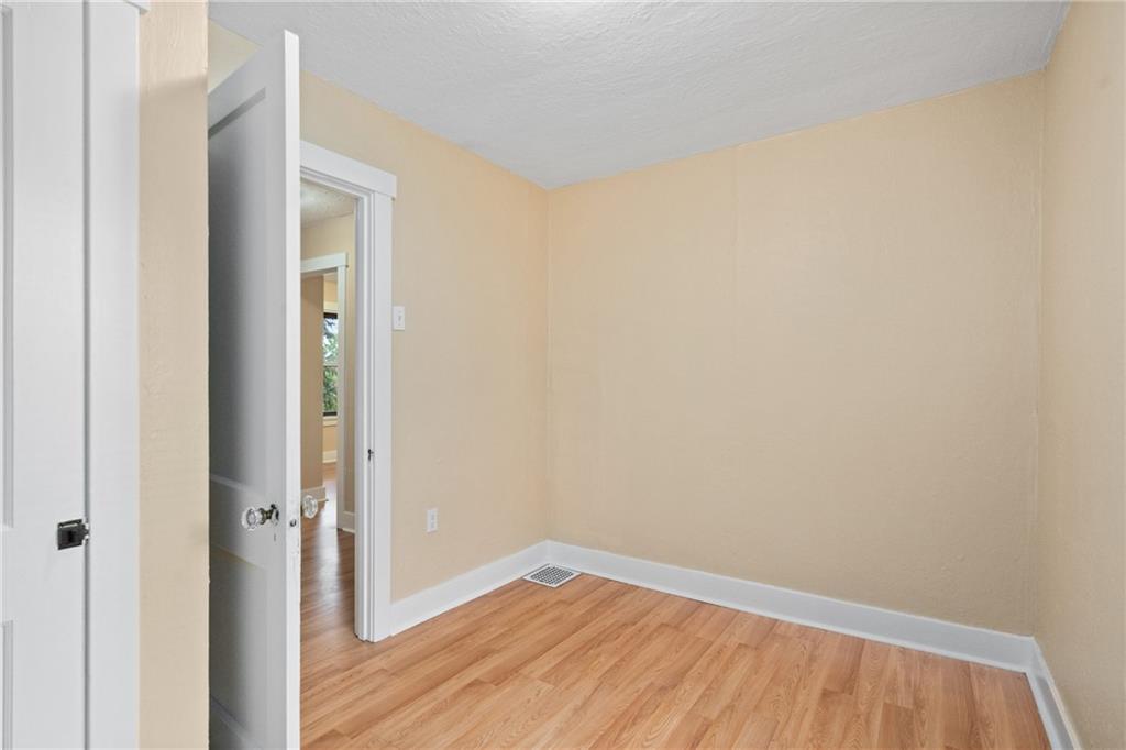 3612 Main Street Homestead, PA 15120 - Photo 22 of 30 a view of a small space with wooden floor and a hallway
