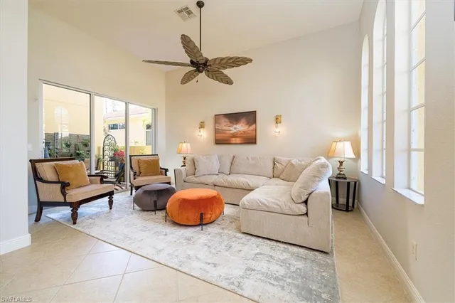 a living room with furniture and a window