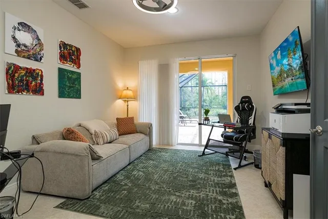 a living room with furniture rug and window
