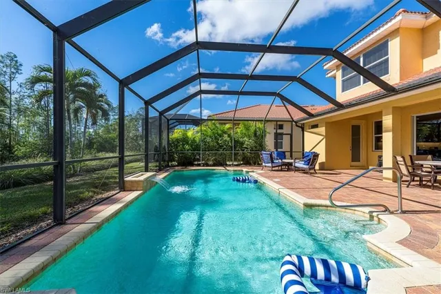 a view of a swimming pool with a patio
