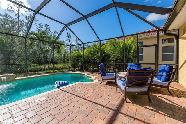 a view of a backyard with a swimming pool