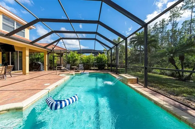 a bathroom with a toilet sink and shower
