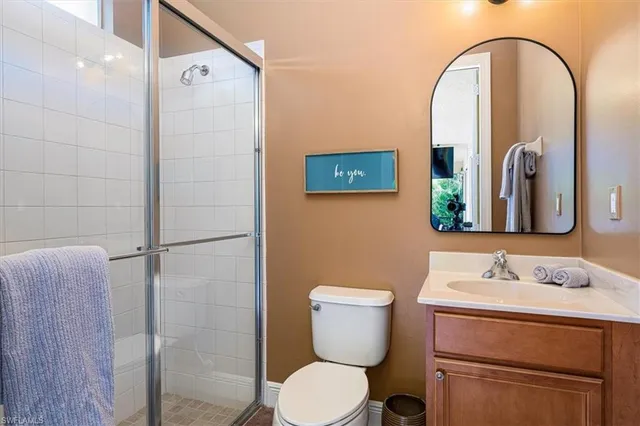 a view of a patio with a table chairs and a floor to ceiling window