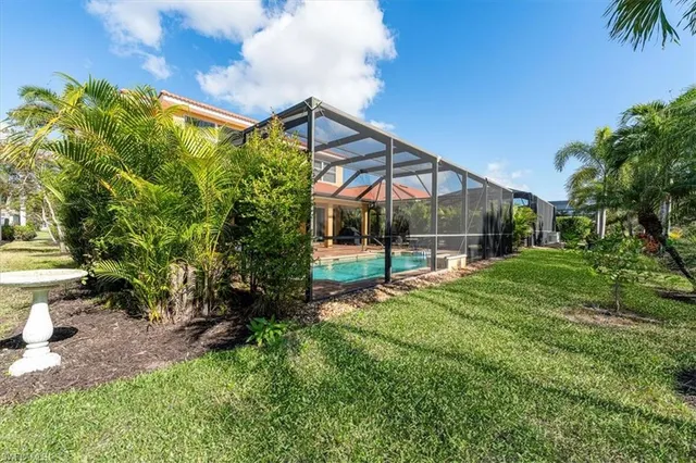 a view of backyard with garden and deck