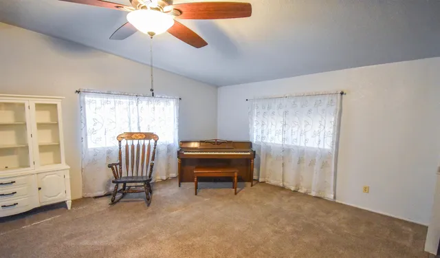 a bedroom with furniture and a window
