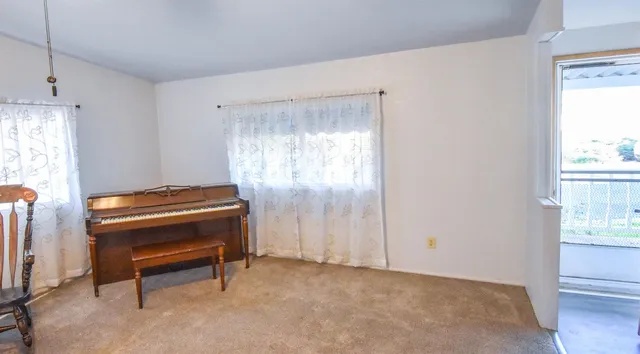 a room with a bed and a window