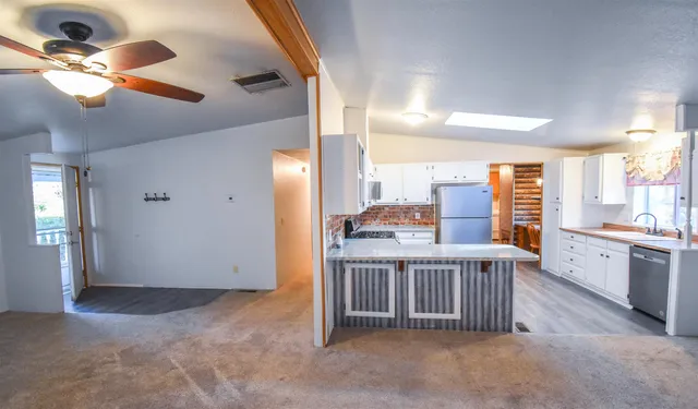 a view of a kitchen and a window