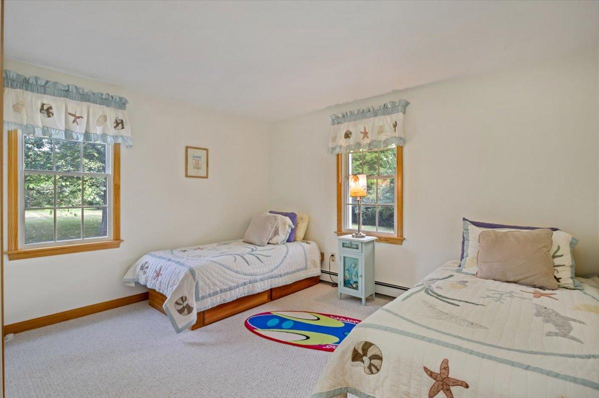 96 Barley Neck Road Orleans, MA 02653 - Photo 23 of 58 a bedroom with a bed and a window