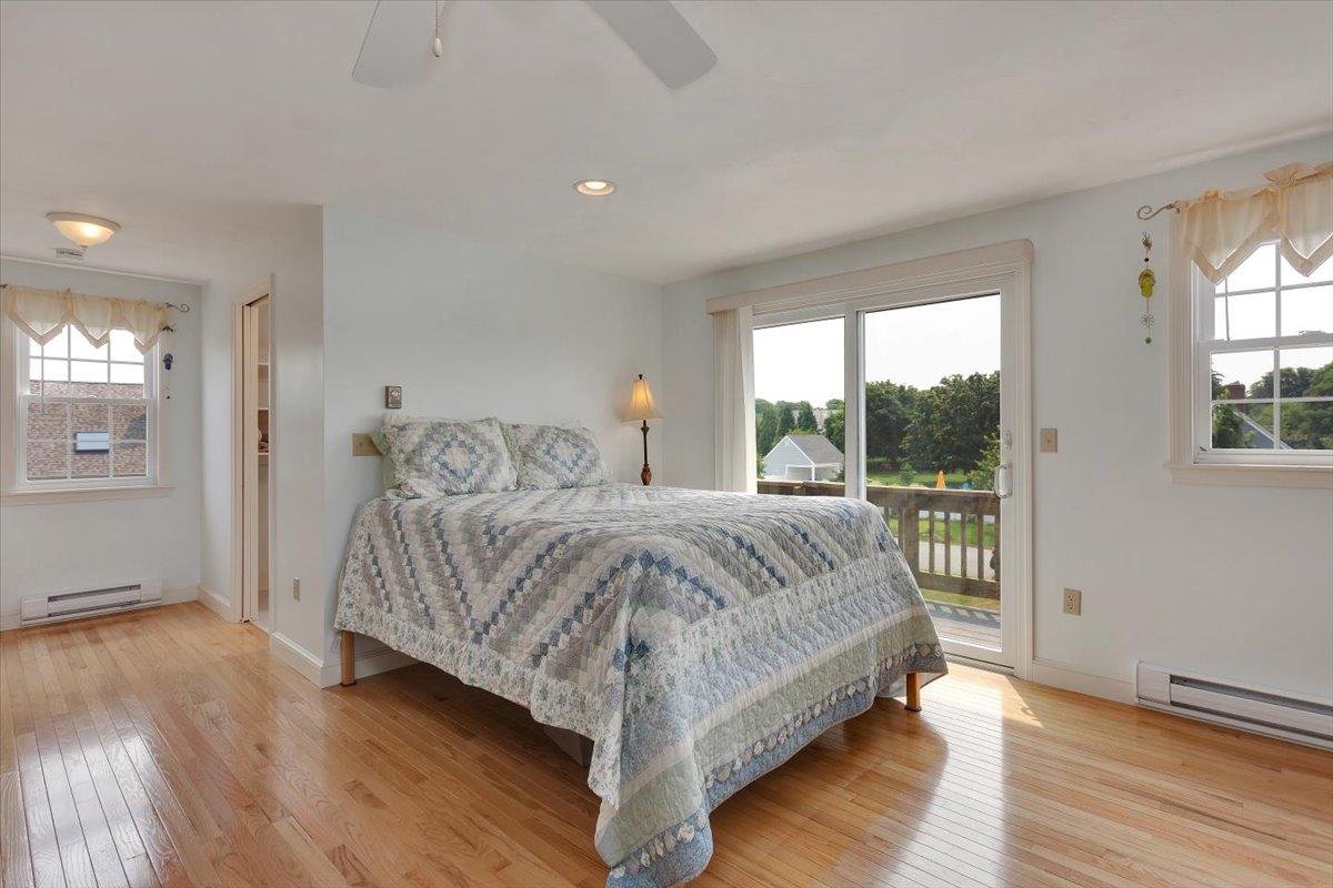96 Barley Neck Road Orleans, MA 02653 - Photo 54 of 58 a bedroom with a bed and window