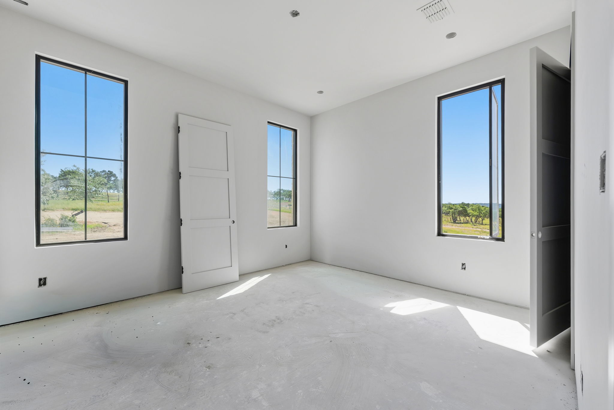 3300 Rm-165 Dripping Springs Dripping Springs, TX 78620 - Photo 20 of 25 a view of an empty room with a window and closet
