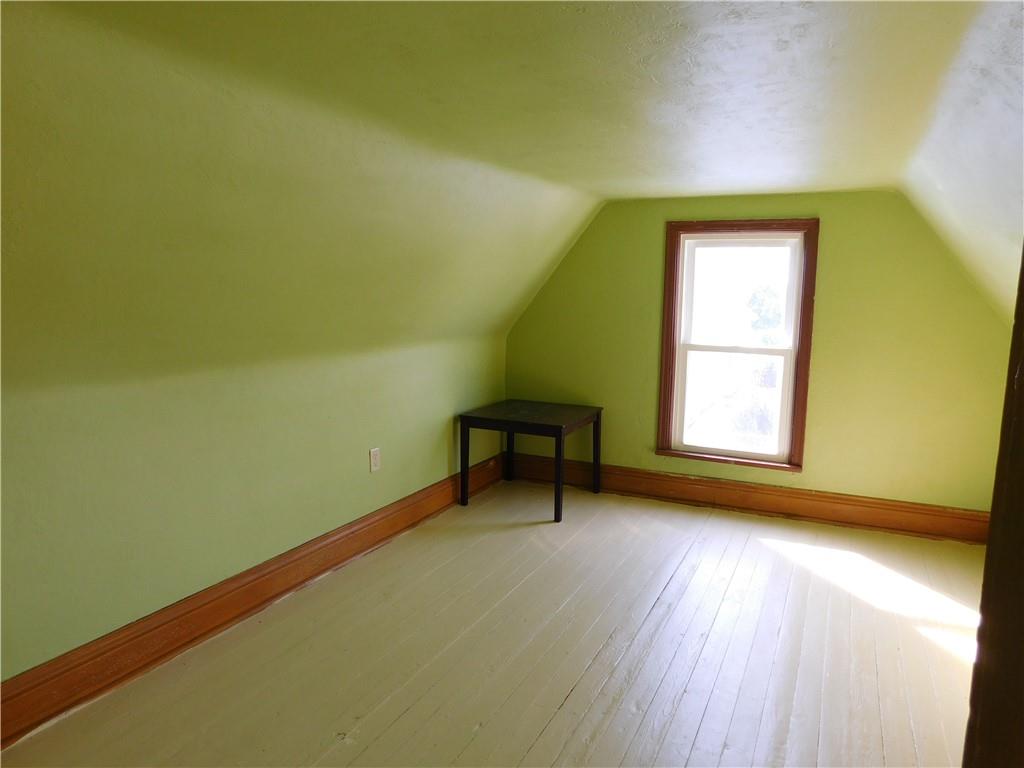 119 April Way Braddock, PA 15104 - Photo 12 of 16 a view of a room with wooden floor and a window