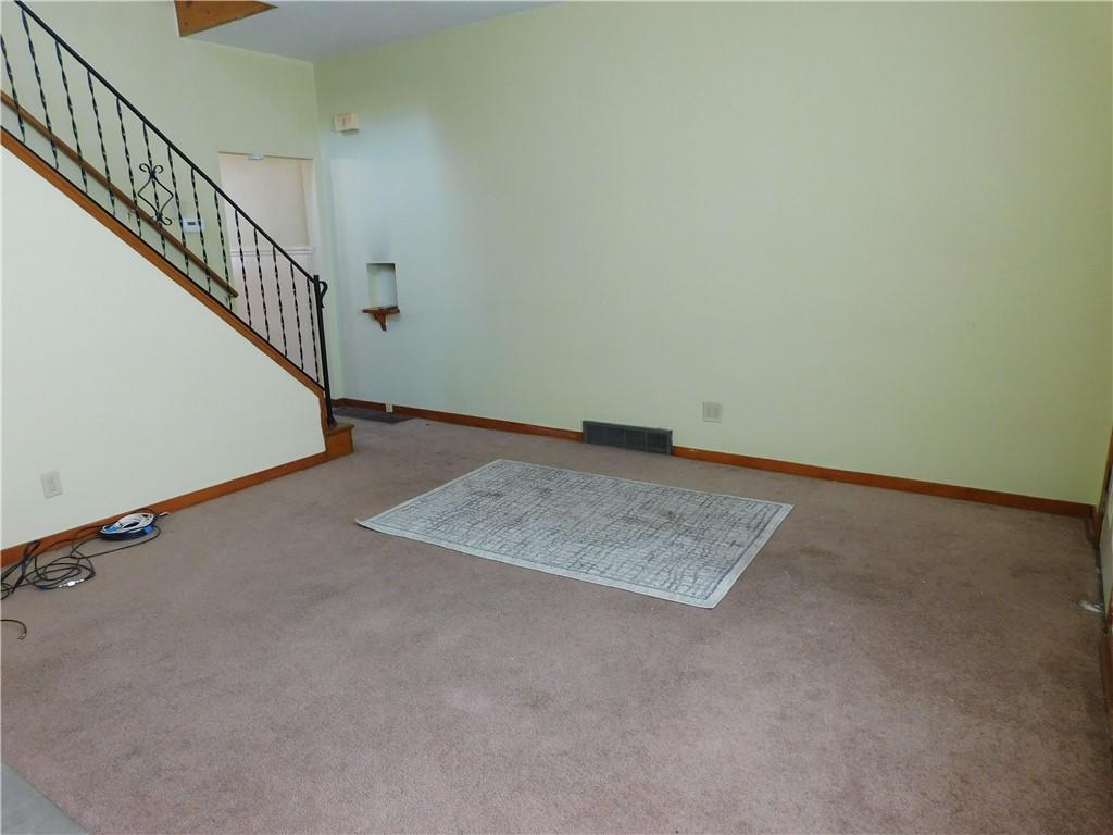 119 April Way Braddock, PA 15104 - Photo 2 of 16 a view of an empty room with stairs