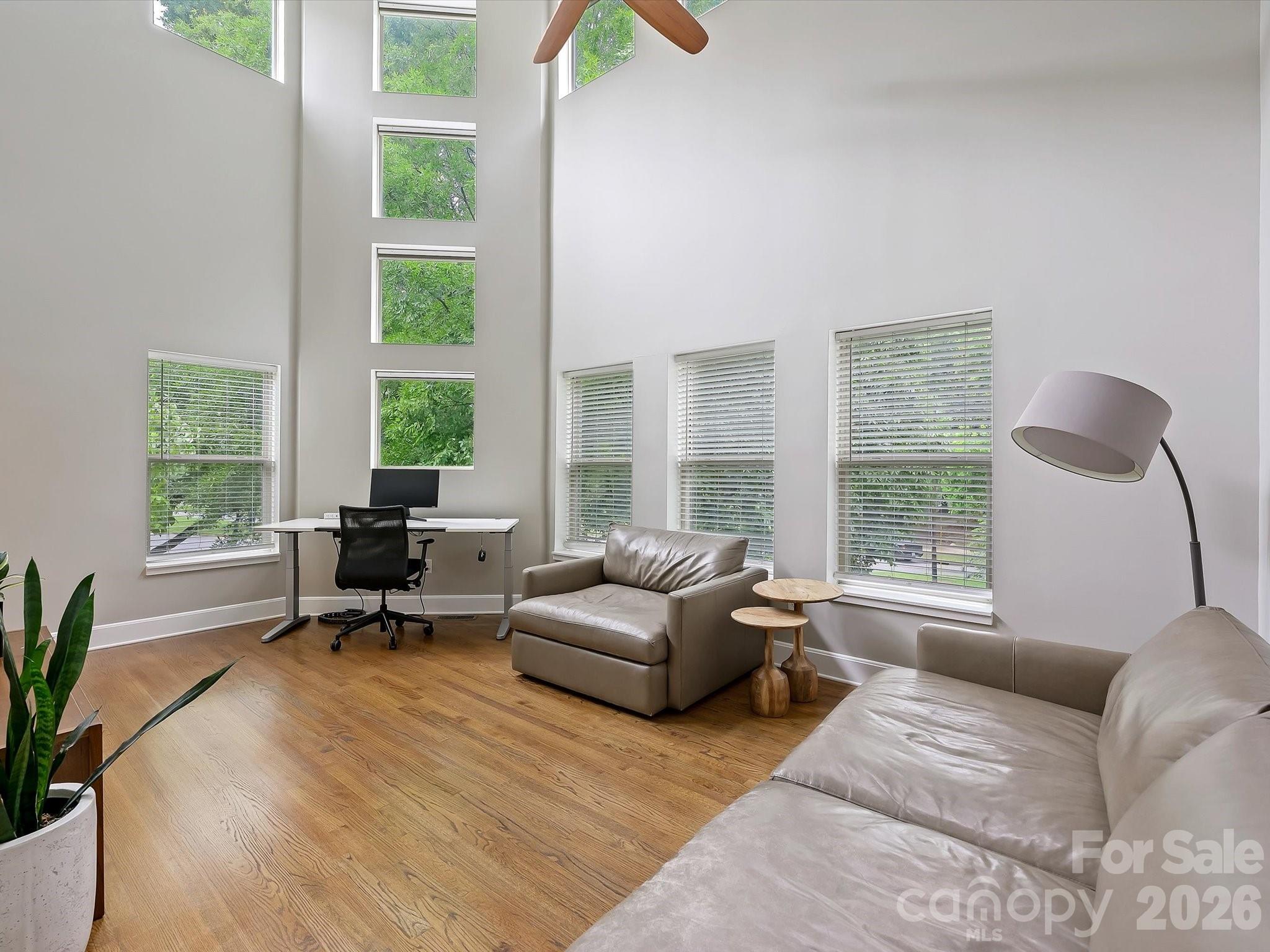 420 Queens Road Charlotte, NC 28207 - Photo 22 of 35 a living room with furniture and a large window