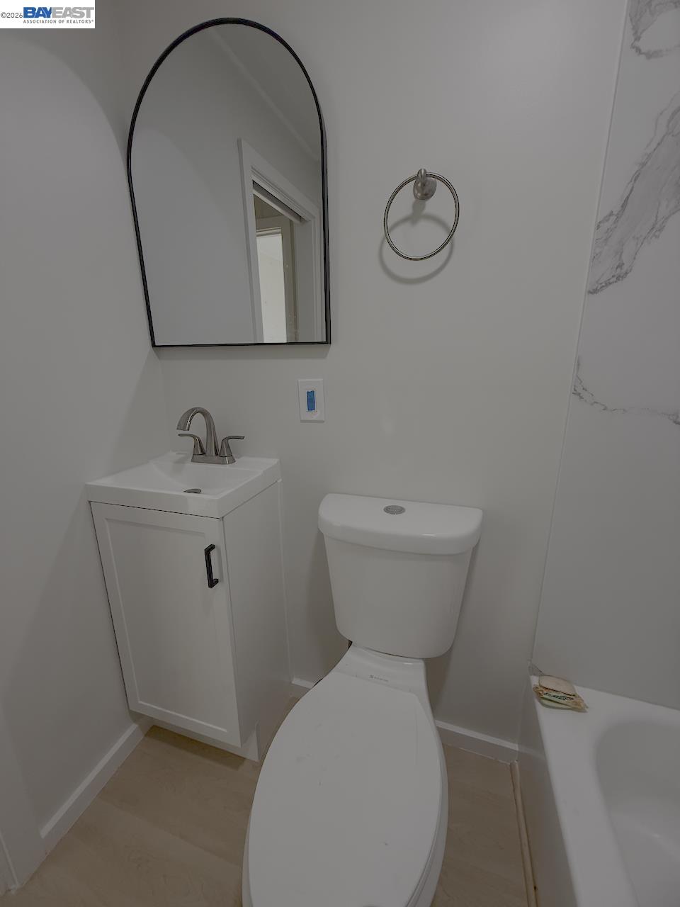 1324 Trenary Way Modesto, CA 95354 - Photo 16 of 17 a bathroom with a toilet sink and mirror