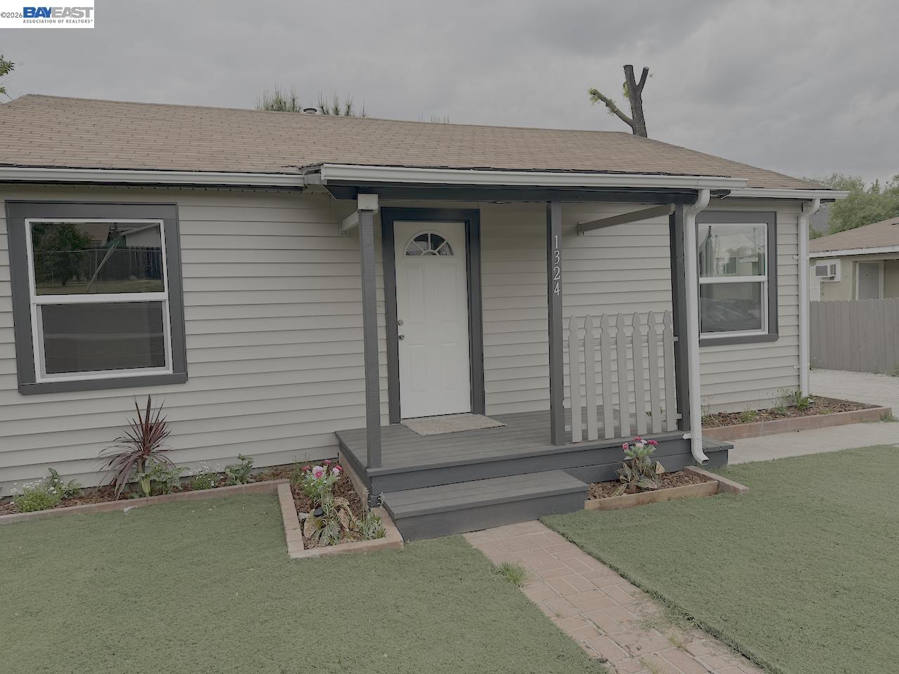 1324 Trenary Way Modesto, CA 95354 - Photo 2 of 17 a front view of a house with garden
