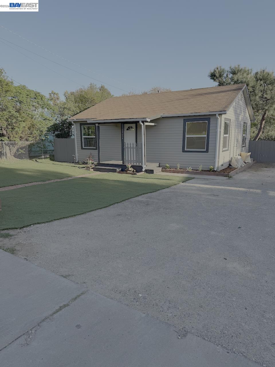 1324 Trenary Way Modesto, CA 95354 - Photo 3 of 17 a front view of a house with a yard and garage