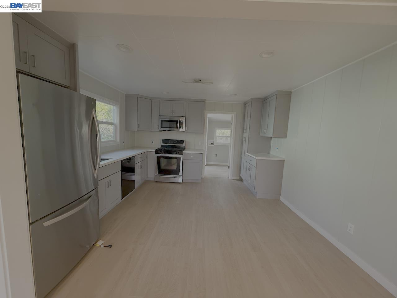 1324 Trenary Way Modesto, CA 95354 - Photo 6 of 17 a kitchen with stainless steel appliances a refrigerator and a stove top oven