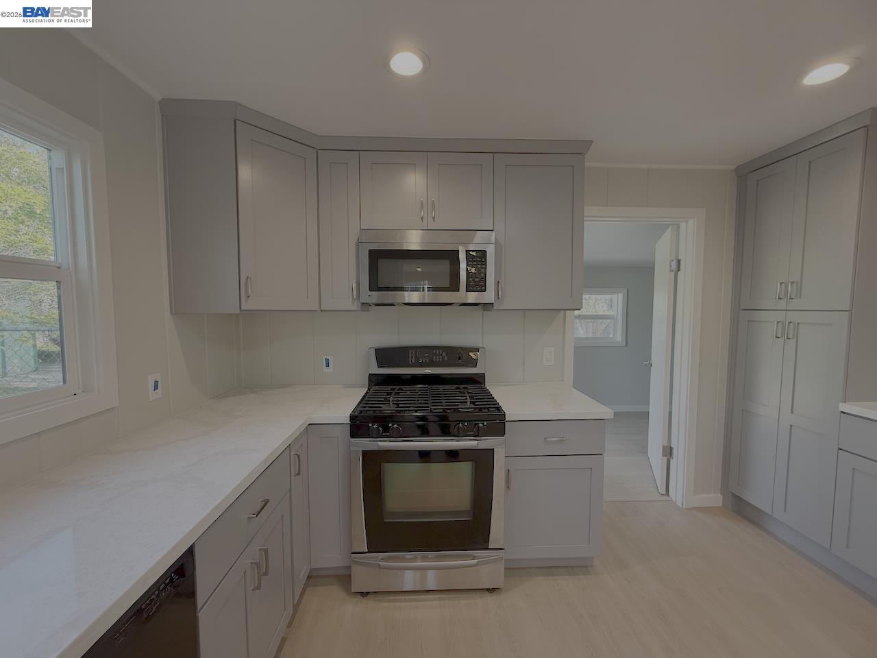 1324 Trenary Way Modesto, CA 95354 - Photo 7 of 17 a kitchen with a stove and a microwave