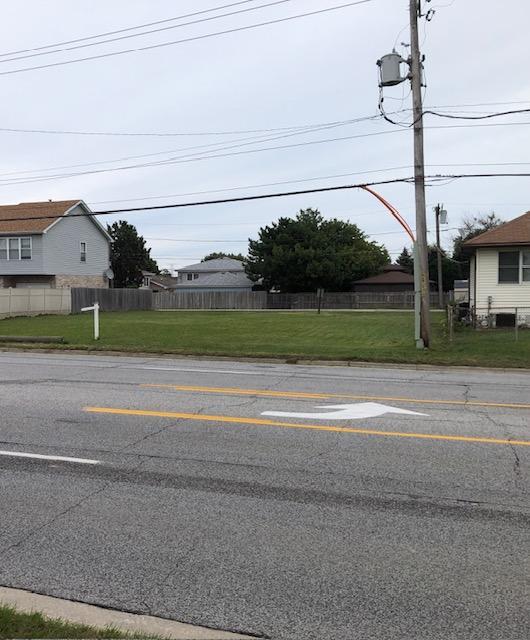8545 South Roberts Road Justice, IL 60458 - Photo 4 of 4 a view of a house with a big yard and potted plants