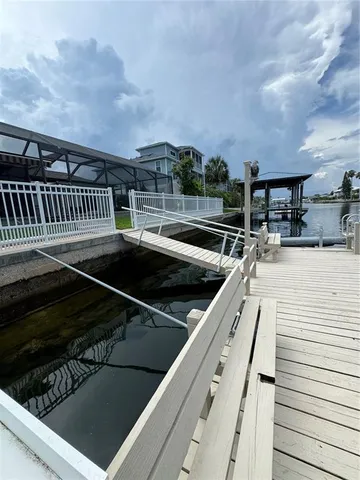 a terrace with outdoor seating and trees