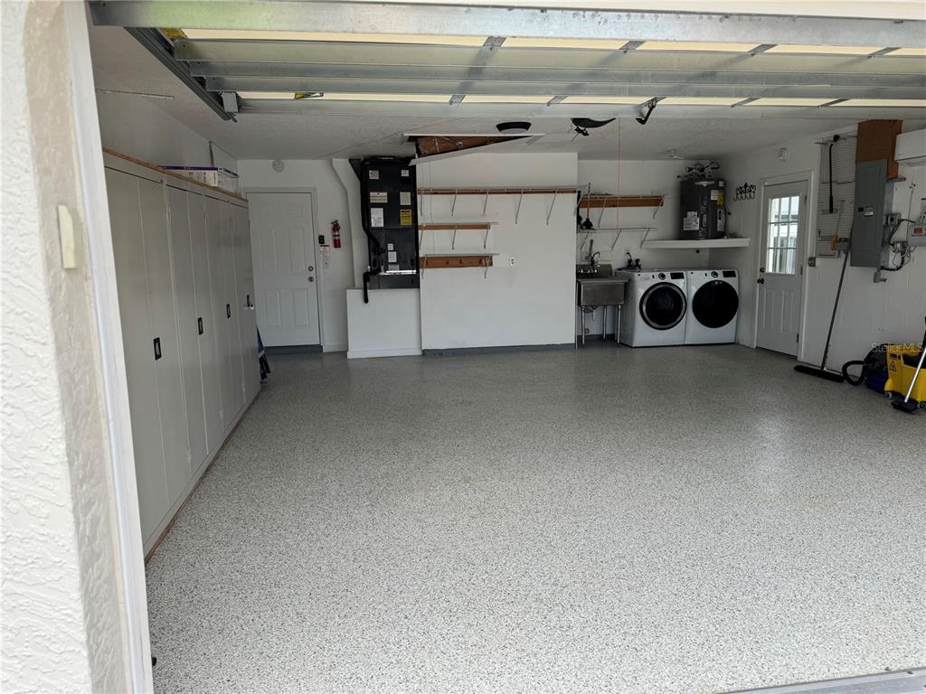 4385 7th Isle Drive Hernando Beach, FL 34607 - Photo 25 of 25 a utility room with dryer and washer