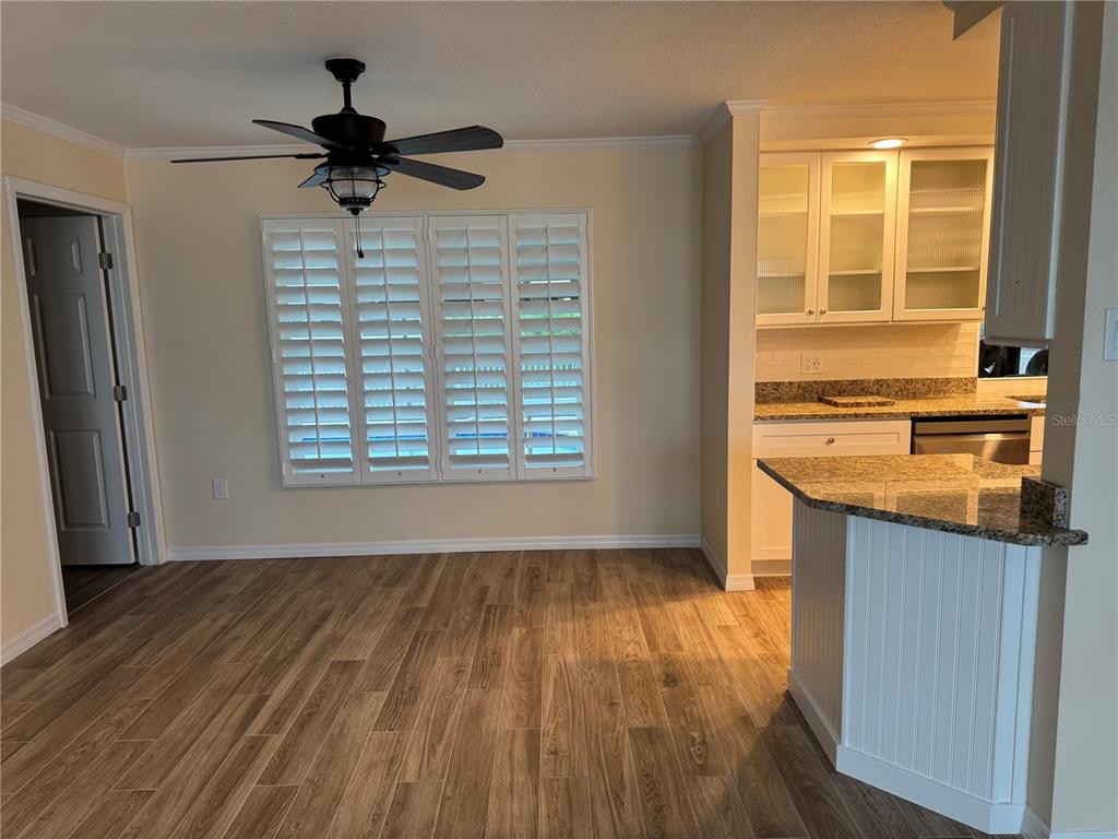 4385 7th Isle Drive Hernando Beach, FL 34607 - Photo 6 of 25 wooden floor in an empty room with a window