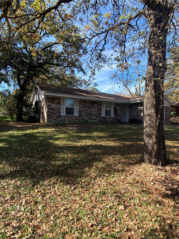 136 Richard Lane Azle, TX 76020 - Photo 1 of 13 a view of a house with a yard