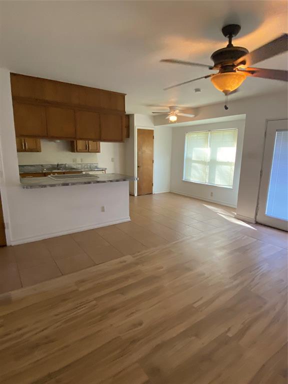 136 Richard Lane Azle, TX 76020 - Photo 11 of 13 a view of a kitchen with a sink and cabinets