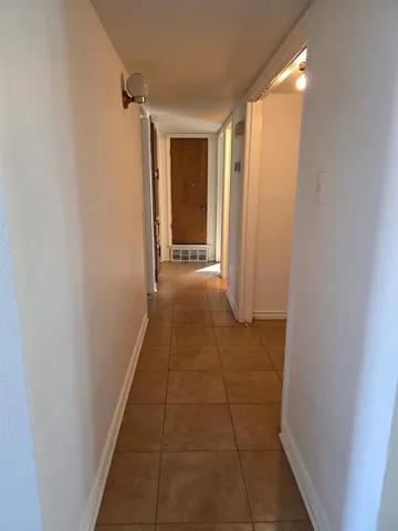 a view of hallway with walk in closet