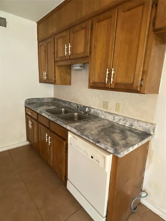 136 Richard Lane Azle, TX 76020 - Photo 4 of 13 a kitchen with granite countertop a sink a stove and a microwave oven