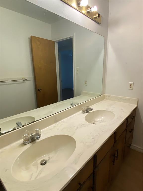 136 Richard Lane Azle, TX 76020 - Photo 6 of 13 a bathroom with a sink and a mirror