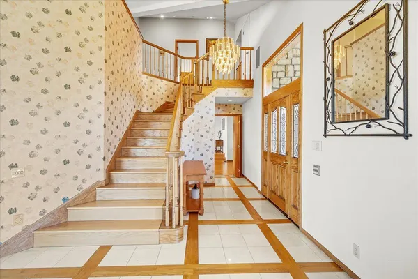 a view of a dining room with furniture and a kitchen