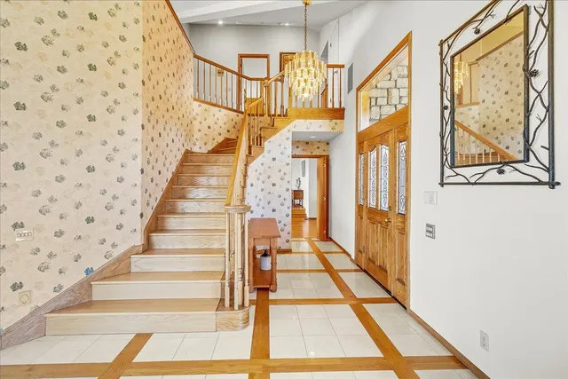 a view of a dining room with furniture and a kitchen