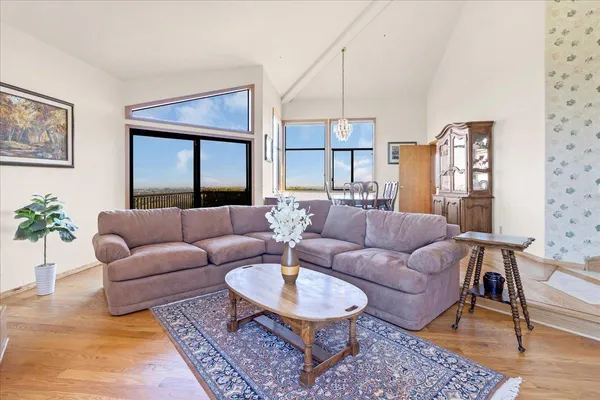 a kitchen with stainless steel appliances granite countertop a sink a stove and a refrigerator